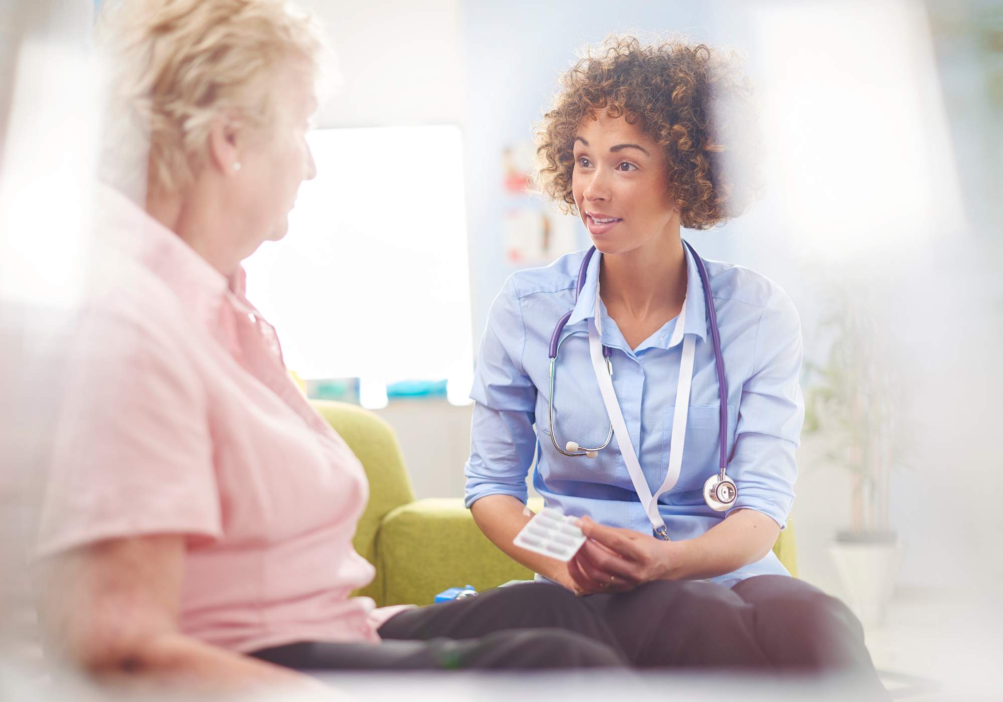 doctor talking to older lady