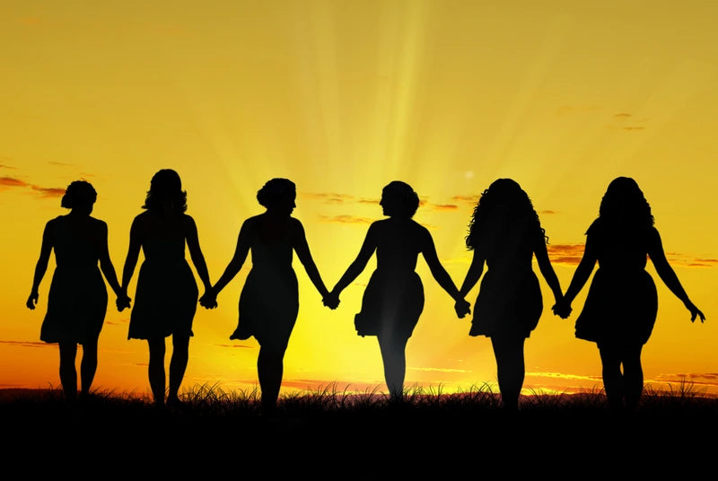Woman silhouette in setting sun