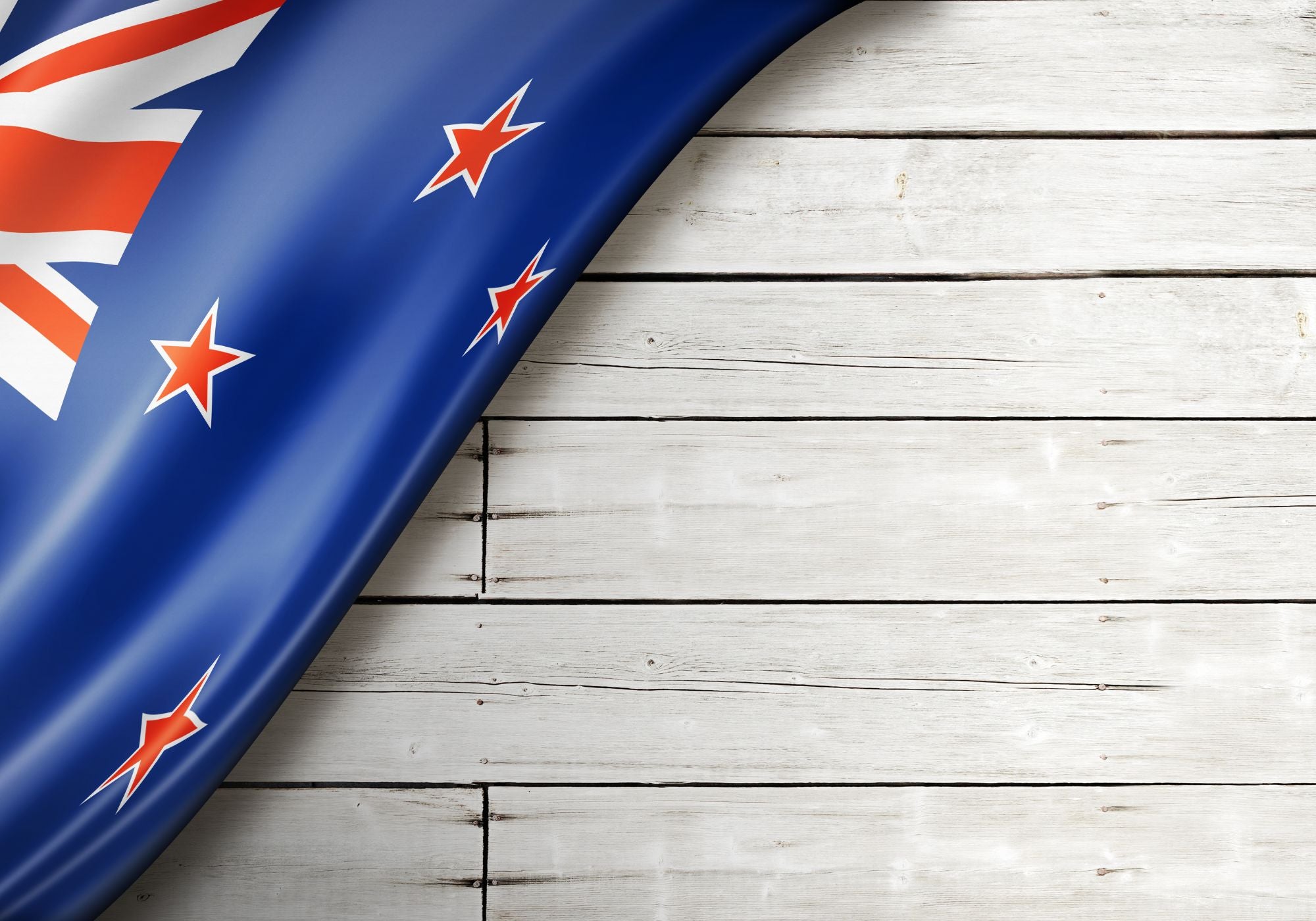 NZ flag on wood background