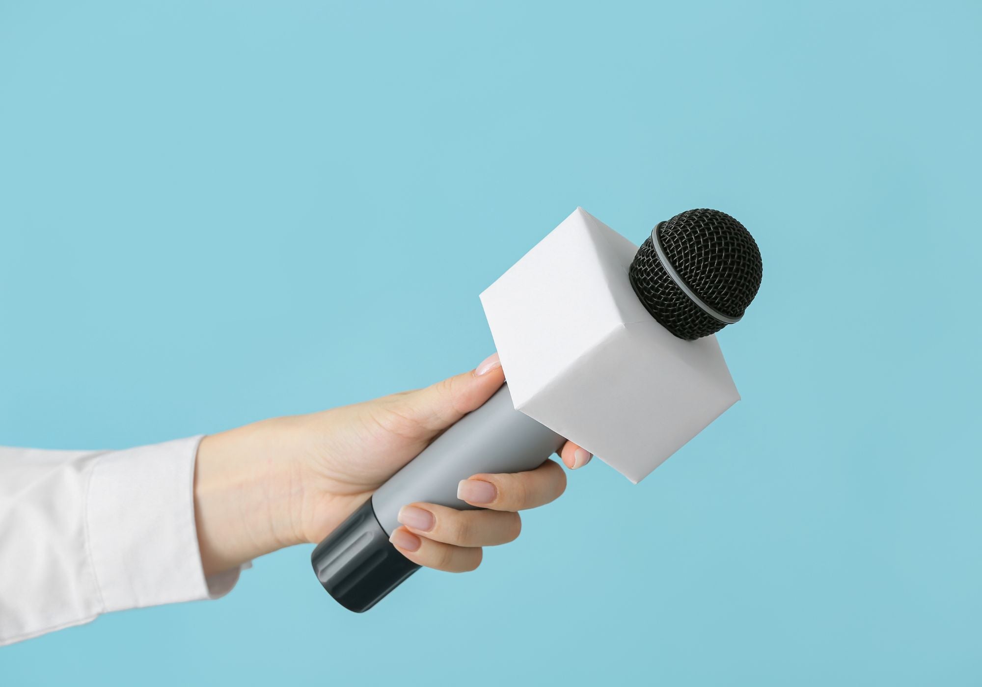 microphone being held by woman
