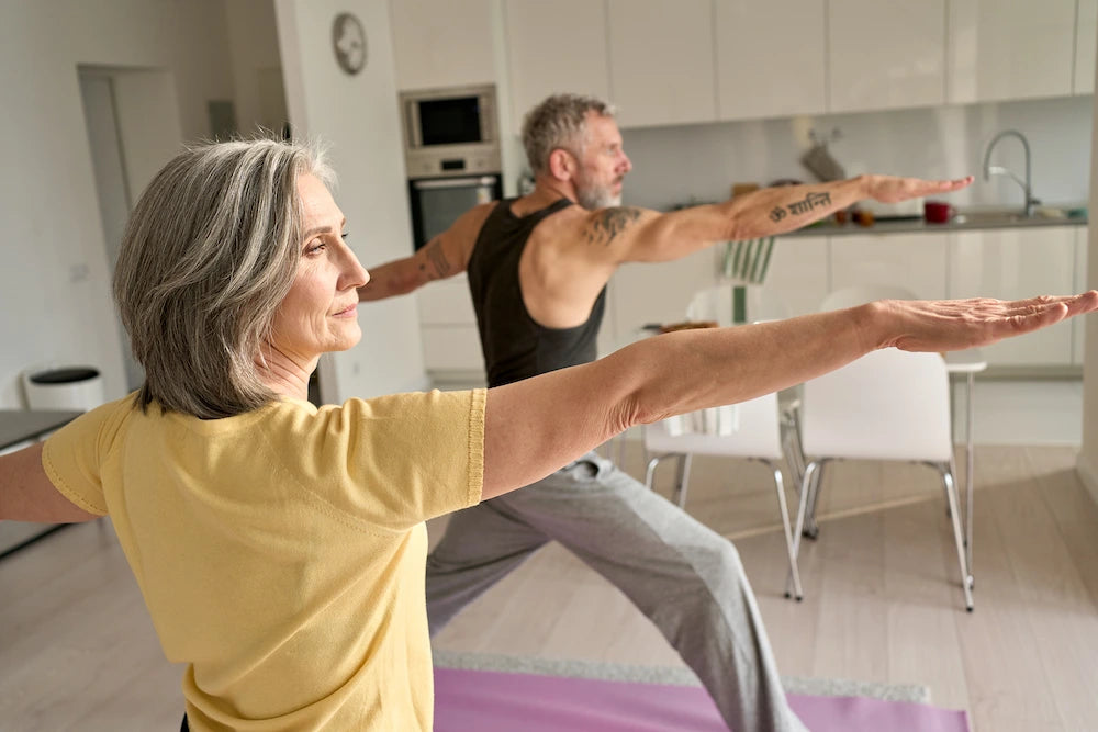 FIT-MIDDLE-AGED-FAMILY-COUPLE-WARRIOR-YOGA